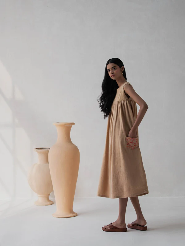 a lady wearing flared cotton dress